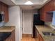 Efficient kitchen features stainless steel appliances, granite counters, and hardwood floors at 10200 Gandy N Blvd # 209, St Petersburg, FL 33702