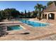 Resort-style community pool featuring a large pool, jacuzzi, and ample seating for residents at 10200 Gandy N Blvd # 209, St Petersburg, FL 33702
