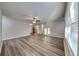 Bright living room featuring modern vinyl plank flooring and a ceiling fan at 1109 Estatewood Dr, Brandon, FL 33510