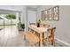 Cozy dining area featuring a wooden table, bench seating, and stylish wall decor at 11838 Davis Dr, Largo, FL 33774