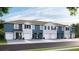 Beautiful townhomes feature a blend of light blue and gray siding, with white trim and dark shutters at 11854 Davis Dr, Largo, FL 33774