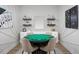 Fun game room featuring a poker table, decorative shelves, and stylish accents at 12339 Hearts Ease St, Venice, FL 34293