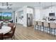 Open-concept living space connecting the kitchen, dining, and living areas with views to the outdoors at 12339 Hearts Ease St, Venice, FL 34293