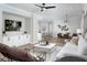Open living area featuring a modern design, comfortable seating, and views into the kitchen at 12339 Hearts Ease St, Venice, FL 34293