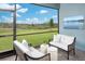 Inviting screened patio with comfortable seating and a tranquil view of nature at 12339 Hearts Ease St, Venice, FL 34293