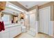 Neutral bathroom featuring a vanity, a glass-enclosed shower, and a skylight for ample natural light at 13255 Don Loop, Spring Hill, FL 34609