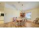 Traditional dining room featuring a chandelier and wood floors at 13255 Don Loop, Spring Hill, FL 34609