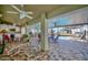 Covered outdoor patio with brick flooring, ceiling fans, and views of the pool area at 13255 Don Loop, Spring Hill, FL 34609