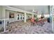 Large covered patio with a fireplace, grill area, and outdoor seating at 13255 Don Loop, Spring Hill, FL 34609