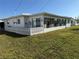 Enclosed patio features bright windows and a spacious area at 14132 89Th Ave, Seminole, FL 33776