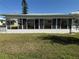 Enclosed patio features bright windows and a spacious area at 14132 89Th Ave, Seminole, FL 33776