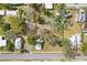 An overhead look at this cozy house surrounded by lush trees and foliage at 14329 14Th St, Dade City, FL 33523