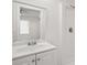 Bright bathroom featuring a single sink vanity with a white shower tub in a home at 14329 14Th St, Dade City, FL 33523