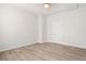 Bedroom with neutral walls and wood-look flooring at 14329 14Th St, Dade City, FL 33523