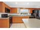 Eat-in kitchen featuring stone countertops and stainless appliances at 14329 14Th St, Dade City, FL 33523