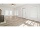 Bright living room with light wood floors, white walls, and natural light at 14329 14Th St, Dade City, FL 33523