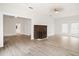 Bright living room showcasing wood floors and a cozy brick fireplace at 14329 14Th St, Dade City, FL 33523