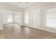 Spacious living area featuring wood-look floors and ample natural light at 14329 14Th St, Dade City, FL 33523