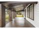 Covered front porch featuring brick pillars and views of the surrounding street at 14329 14Th St, Dade City, FL 33523