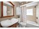 Bathroom with a sink, a mirror, and a shower and tub combination at 2580 Redwood Way, Clearwater, FL 33761