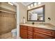 Bathroom features double sinks, granite countertops, and a walk-in shower at 2580 Redwood Way, Clearwater, FL 33761