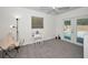 Bedroom with a chair, a vanity, and glass doors leading to the backyard pool at 2580 Redwood Way, Clearwater, FL 33761