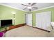Bedroom with a ceiling fan, a closet with a sliding door, and natural lighting at 2580 Redwood Way, Clearwater, FL 33761
