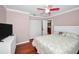 Bedroom with a ceiling fan, closet and a glimpse into the kitchen at 2580 Redwood Way, Clearwater, FL 33761