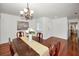Formal dining room featuring hardwood floors, a chandelier, and wooden furniture at 2580 Redwood Way, Clearwater, FL 33761