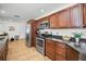 Spacious kitchen featuring granite countertops, stainless appliances, and tile flooring at 2580 Redwood Way, Clearwater, FL 33761