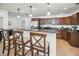 Open kitchen with granite countertops, stainless appliances, and bar seating at 2580 Redwood Way, Clearwater, FL 33761