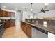 Bright kitchen featuring granite counters, stainless appliances, and ample cabinet space at 2580 Redwood Way, Clearwater, FL 33761