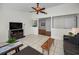 Bright and airy living room showcasing an open floor plan, tile flooring, and ample space at 2580 Redwood Way, Clearwater, FL 33761