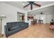 Bright living room features an open-concept layout with an eat-in kitchen and access to a sun room at 2580 Redwood Way, Clearwater, FL 33761
