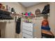 Walk-in closet with shelving and a chest of drawers for organizing clothes and accessories at 2580 Redwood Way, Clearwater, FL 33761
