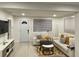 Inviting living room featuring modern furniture, neutral decor, and an abundance of natural light at 2613 E 23Rd Ave, Tampa, FL 33605