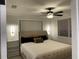 Cozy main bedroom featuring neutral tones, soft lighting, and a luxurious upholstered headboard at 2613 E 23Rd Ave, Tampa, FL 33605
