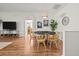 Cozy dining area featuring a round table, pendant lighting, and a seamless transition to the living space at 30613 Midtown Ct, Wesley Chapel, FL 33545