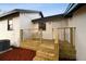 Exterior with a wooden deck and steps leading to the backyard at 38638 2Nd Ave, Zephyrhills, FL 33542