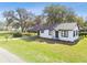 Delightful single-story home with a carport and a well-manicured lawn and landscape at 38638 2Nd Ave, Zephyrhills, FL 33542