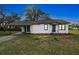 Charming single-story home with a covered carport and a well-maintained front lawn at 38638 2Nd Ave, Zephyrhills, FL 33542