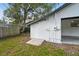 Shed in the backyard with a concrete ramp and wood siding at 38638 2Nd Ave, Zephyrhills, FL 33542