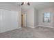 Neutral bedroom with carpet, ceiling fan, window, and closet at 4549 Chinkapin Dr, Sarasota, FL 34232
