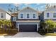 Charming two-story townhome featuring an attached garage and well-manicured landscaping at 4549 Chinkapin Dr, Sarasota, FL 34232