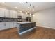 Modern kitchen with granite countertops, stainless steel appliances, and a center island at 4549 Chinkapin Dr, Sarasota, FL 34232