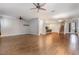 Open-concept living space with wood-look tile floors flowing into kitchen and dining areas at 4549 Chinkapin Dr, Sarasota, FL 34232
