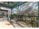 Screened porch overlooking backyard with trees and landscaping at 4549 Chinkapin Dr, Sarasota, FL 34232