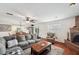 Bright living room featuring a fireplace, hardwood floors, and a plush area rug at 5036 18Th N St, St Petersburg, FL 33714