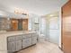 Bathroom featuring a large vanity with a single sink and glass-enclosed shower stall at 5443 Ott Ct, Spring Hill, FL 34608
