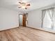Cozy bedroom with wood-look flooring, natural light, and a closet at 5443 Ott Ct, Spring Hill, FL 34608